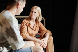 A son talking to his elderly mother